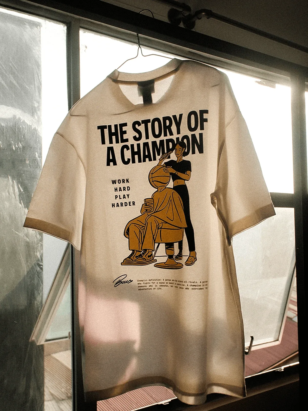 “The Story of a Champion” illustrated Baus T-shirt hanging by a window