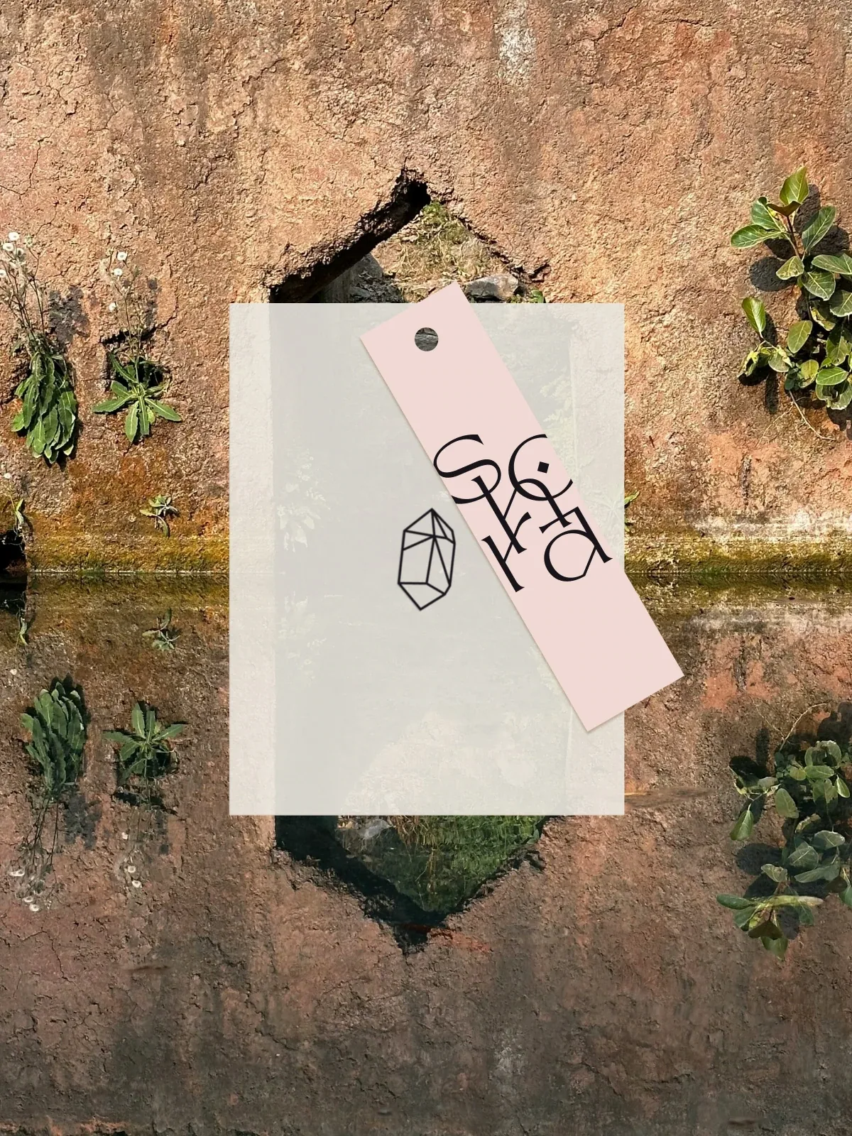 Shora pink hang tag with crystal icon on stone